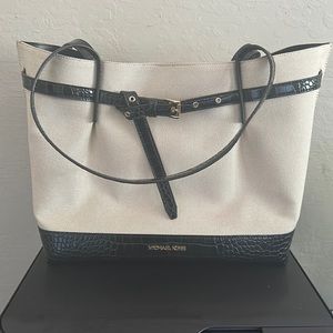 Micheal Kors large tote cream canvas and black leather.